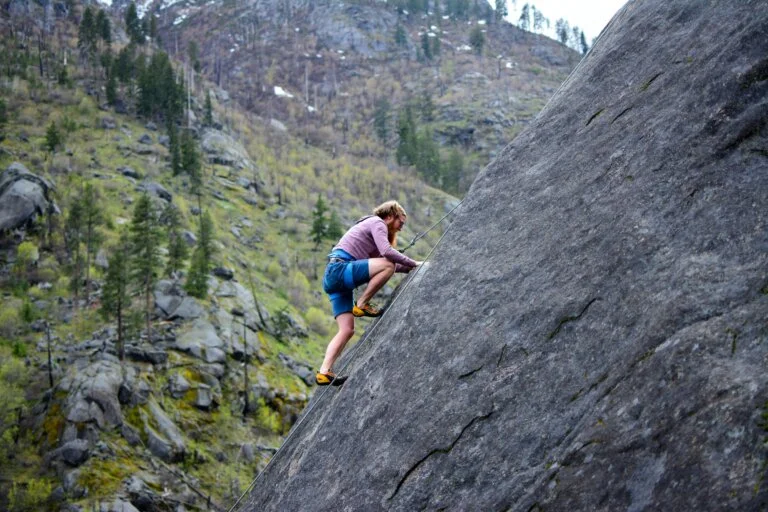 a man climbing a rock wall